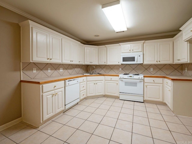 kitchen featuring light tile patterned flooring, white appliances, a sink, decorative backsplash, and crown molding