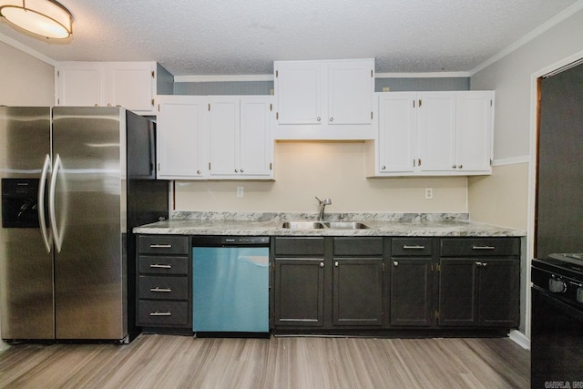 kitchen with dishwashing machine, stainless steel fridge with ice dispenser, a sink, light countertops, and white cabinetry