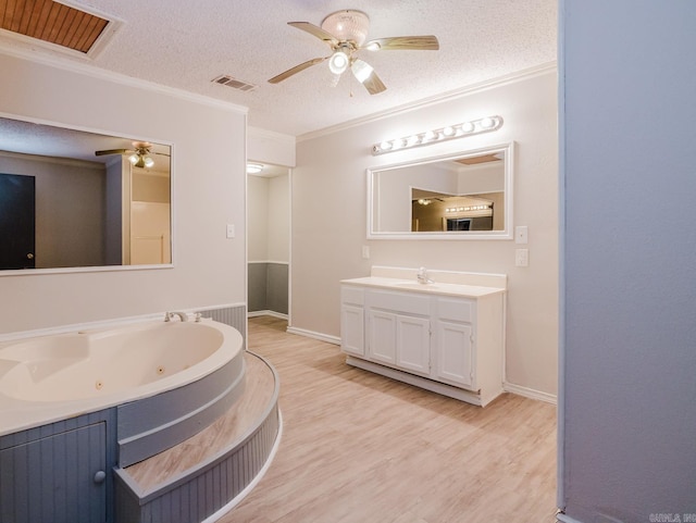 full bathroom featuring crown molding, wood finished floors, visible vents, and a textured ceiling