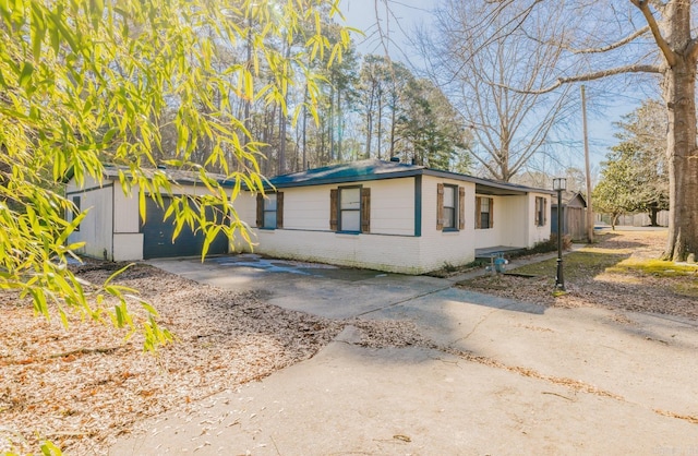 view of front of house featuring brick siding and driveway