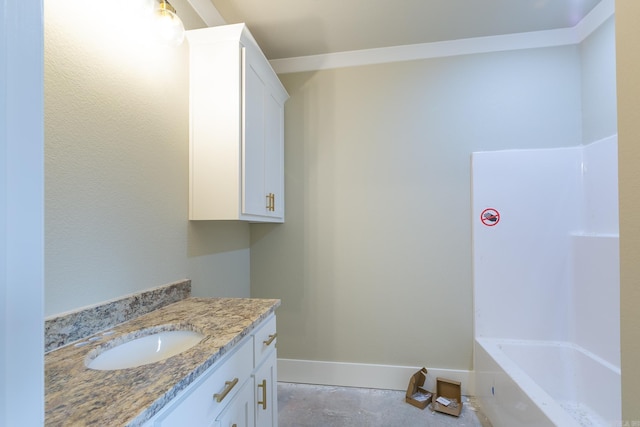 full bathroom with baseboards and vanity