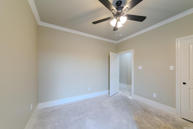 unfurnished room with a ceiling fan, crown molding, baseboards, and concrete flooring