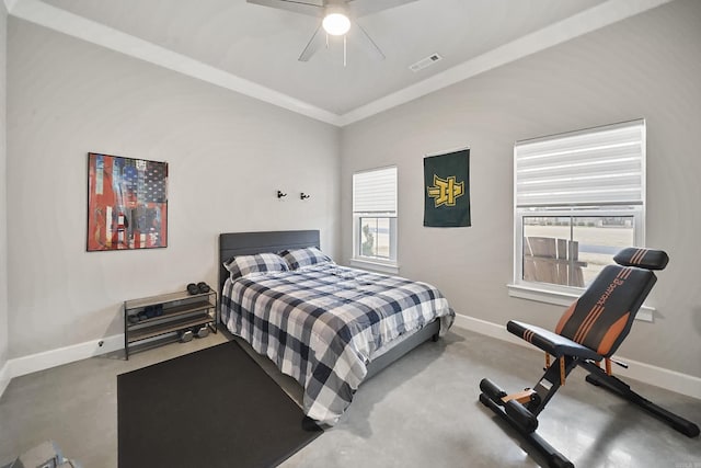 bedroom with multiple windows and baseboards