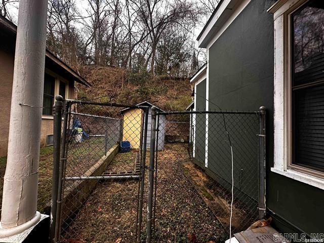 view of yard featuring fence and a gate