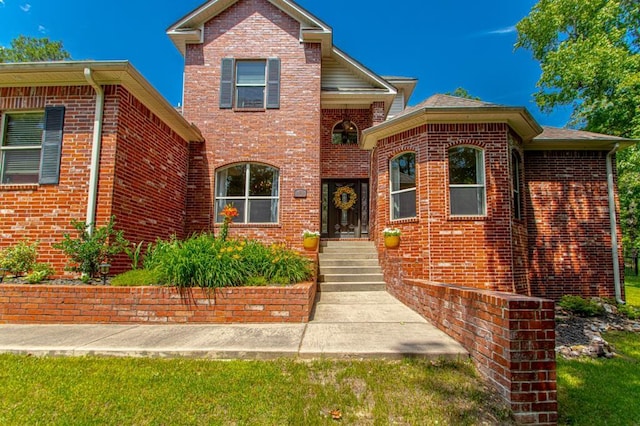 traditional-style home featuring brick siding