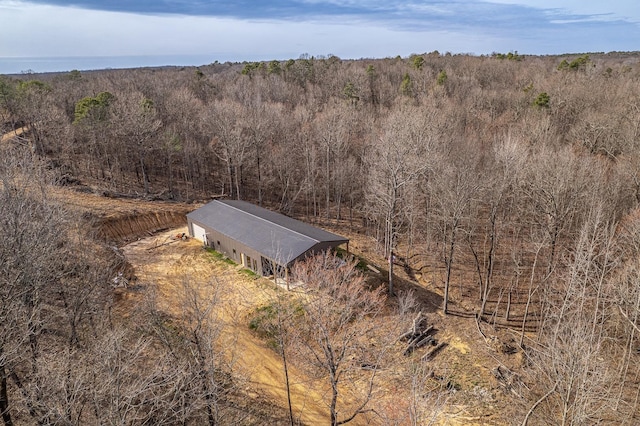 aerial view featuring a wooded view