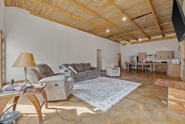 living room with arched walkways, a high ceiling, wooden ceiling, and visible vents