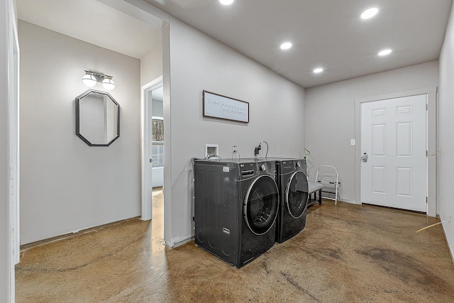 clothes washing area with recessed lighting and independent washer and dryer