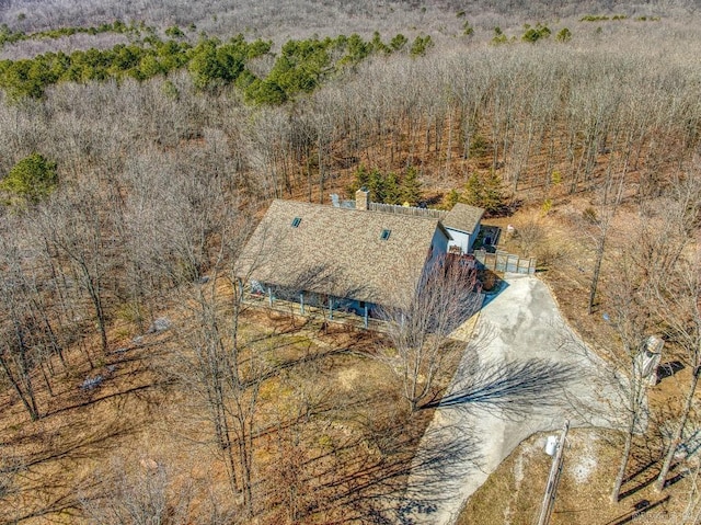 birds eye view of property with a forest view