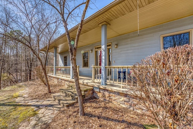 view of side of home with a porch
