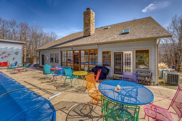 exterior space featuring central AC and grilling area