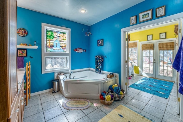 full bathroom with tile patterned flooring, baseboards, a bath, and french doors