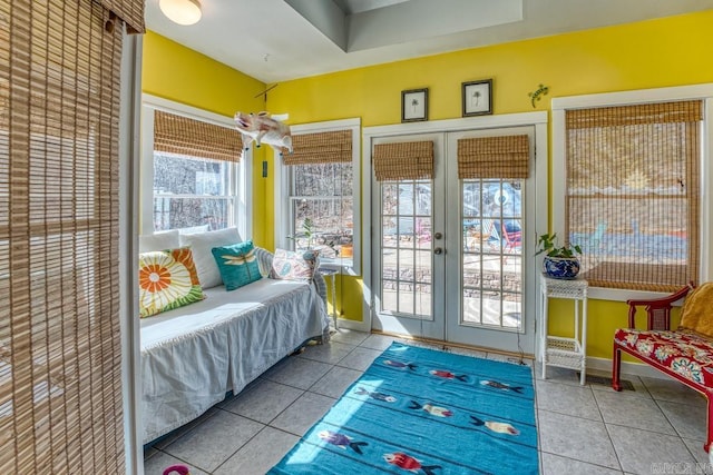 sunroom / solarium featuring french doors