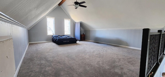 interior space with vaulted ceiling with beams, carpet, baseboards, and ceiling fan