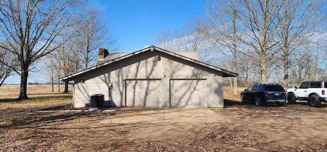 view of outdoor structure with an outbuilding and central AC unit