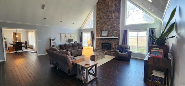 living area with baseboards, dark wood finished floors, and crown molding