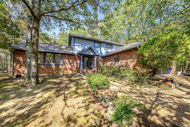 view of front of house with brick siding