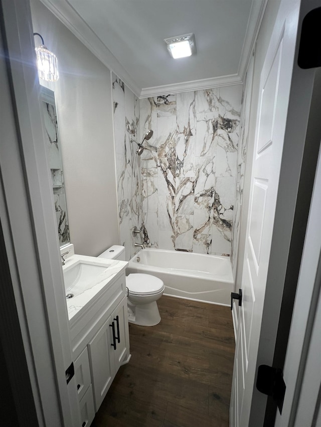 full bath featuring toilet, ornamental molding, tub / shower combination, vanity, and wood finished floors