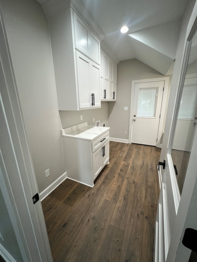 clothes washing area with hookup for a washing machine, recessed lighting, dark wood-type flooring, baseboards, and cabinet space