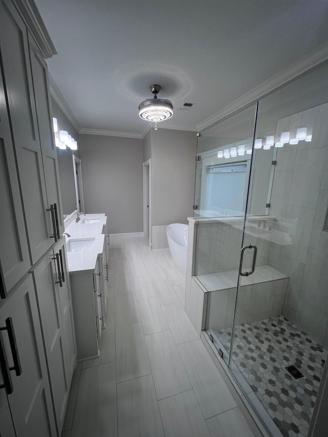 bathroom featuring a stall shower, visible vents, a soaking tub, crown molding, and vanity