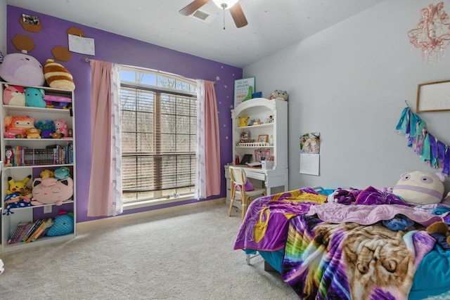 carpeted bedroom featuring a ceiling fan and baseboards