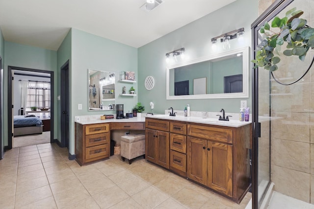 ensuite bathroom featuring ensuite bathroom, double vanity, a sink, and visible vents