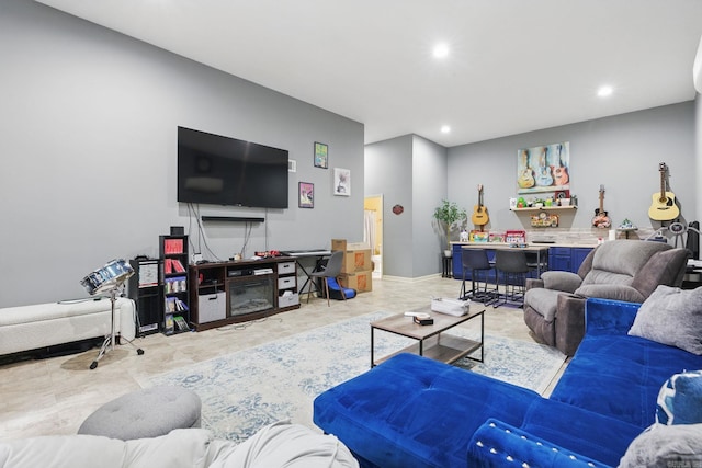 living room featuring a dry bar, baseboards, and recessed lighting