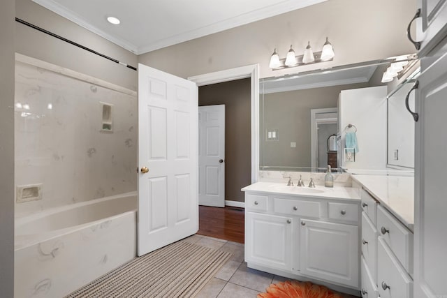 bathroom with tile patterned flooring, vanity, and crown molding