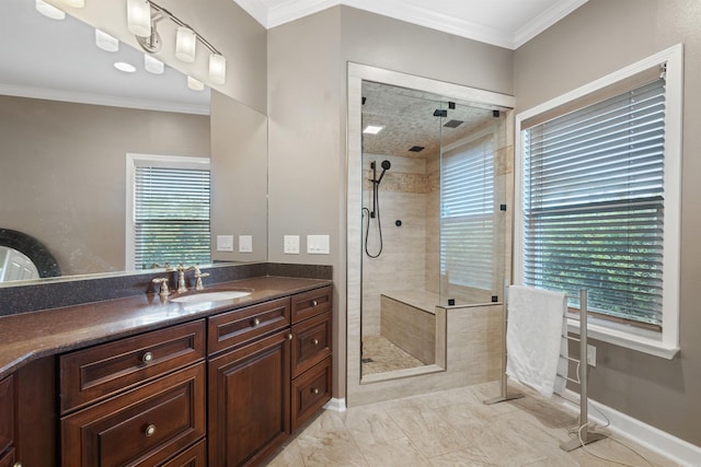 bathroom with vanity, crown molding, baseboards, and a shower stall