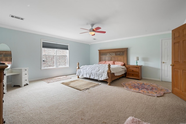 bedroom with visible vents, carpet flooring, and crown molding