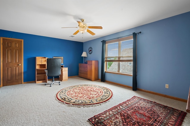 office area featuring ceiling fan, carpet, and baseboards