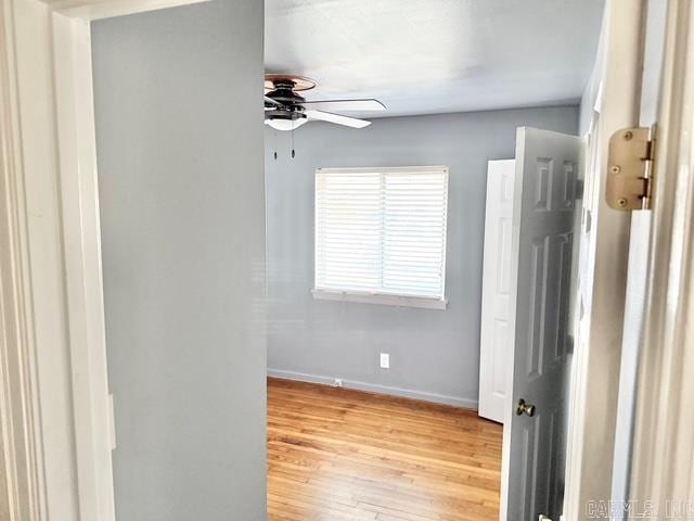 interior space featuring light wood finished floors and baseboards