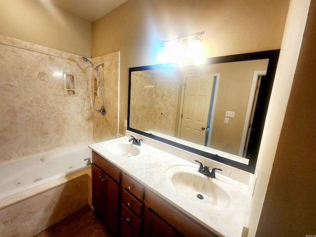 full bathroom with double vanity, tile patterned floors, a combined bath / shower with jetted tub, and a sink