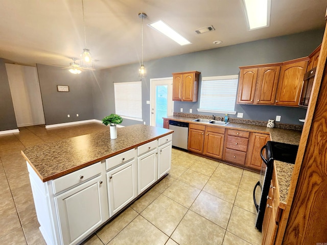 kitchen featuring visible vents, a kitchen island, a sink, black range with electric cooktop, and stainless steel dishwasher