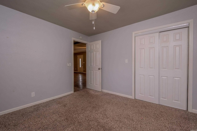 unfurnished bedroom with a closet, a ceiling fan, baseboards, and carpet floors