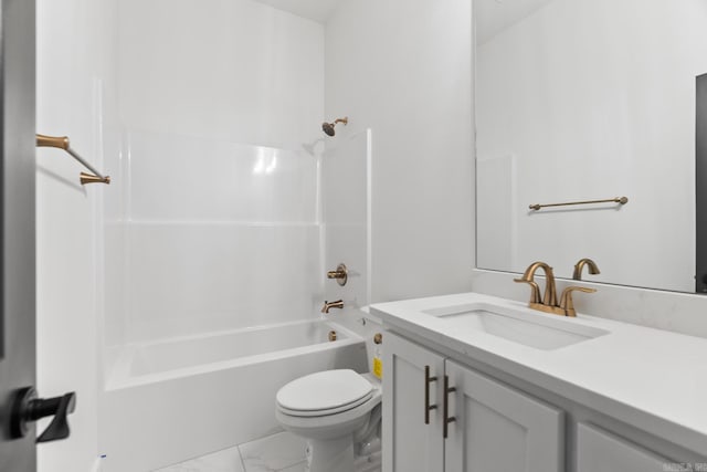 bathroom with marble finish floor, toilet, vanity, and washtub / shower combination