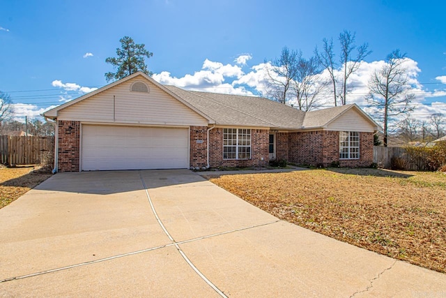 single story home featuring brick siding, concrete driveway, fence, and a garage