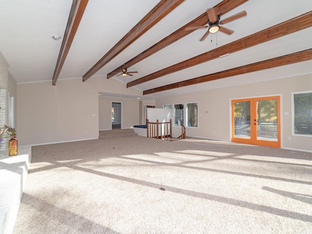 unfurnished living room featuring carpet flooring, vaulted ceiling with beams, baseboards, and ceiling fan