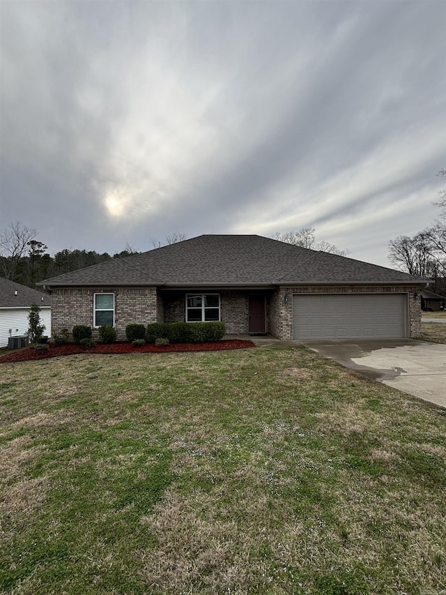 ranch-style house featuring a front yard, a shingled roof, concrete driveway, a garage, and brick siding