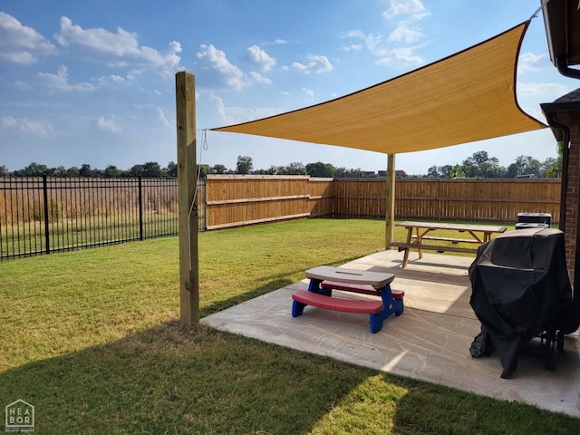 view of yard featuring a patio area and a fenced backyard