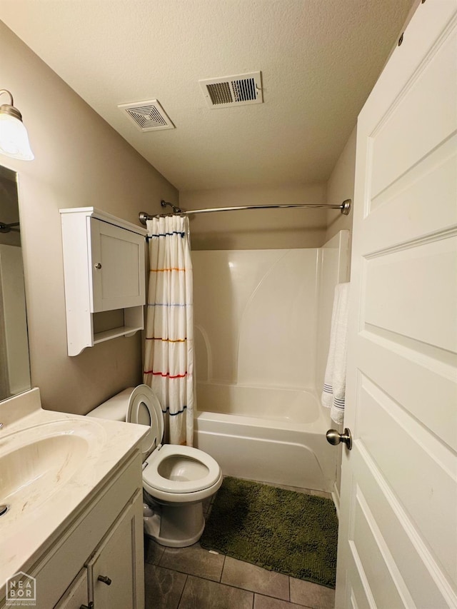 bathroom featuring visible vents, shower / bath combination with curtain, a textured ceiling, and vanity