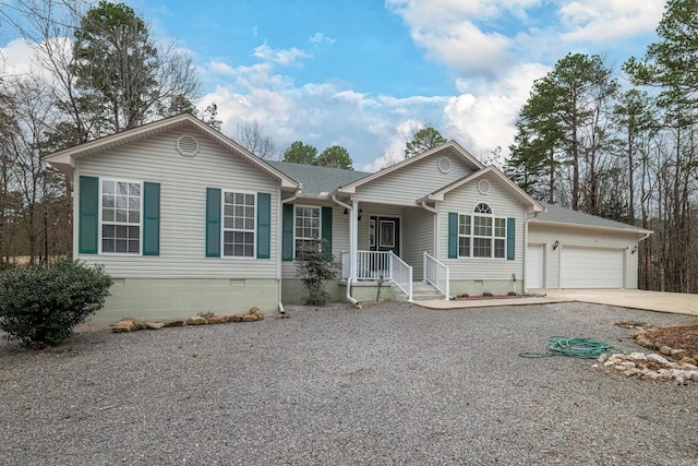 ranch-style house featuring crawl space, a garage, driveway, and a shingled roof