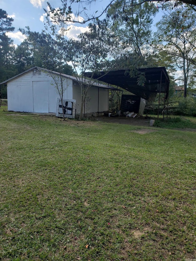 view of yard with an attached carport