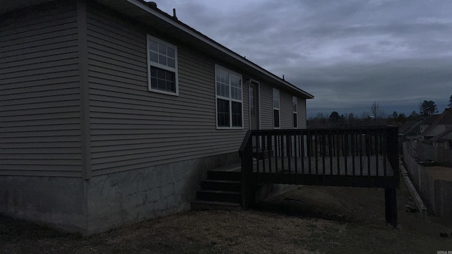 view of side of property featuring a deck