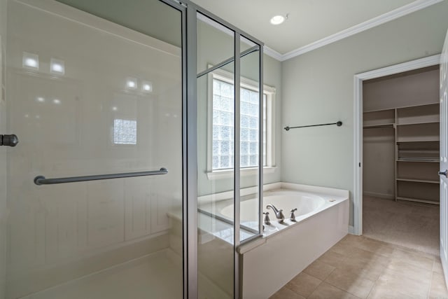 full bath featuring a bath, a shower stall, tile patterned floors, and ornamental molding