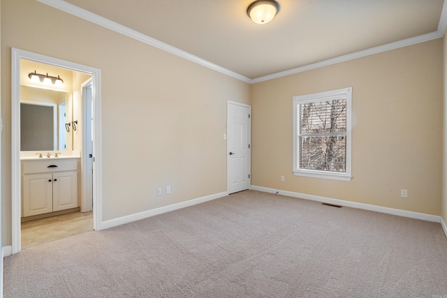 unfurnished bedroom with crown molding, baseboards, and light carpet