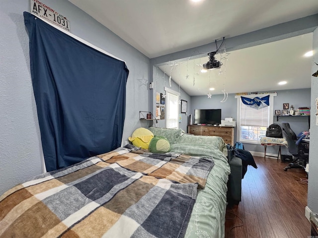 bedroom featuring baseboards and hardwood / wood-style floors