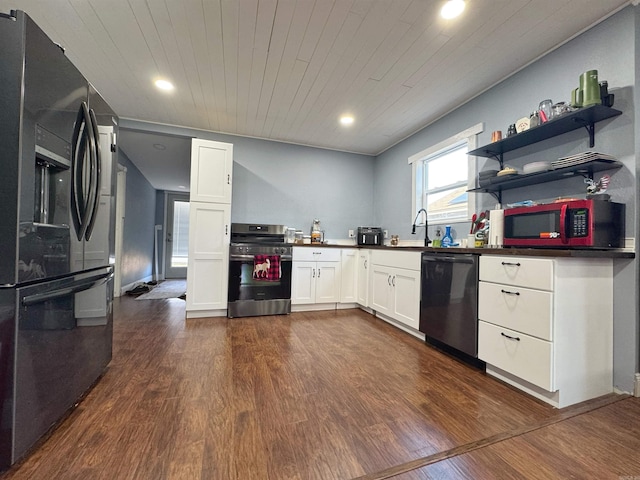 kitchen with dark countertops, appliances with stainless steel finishes, wooden ceiling, white cabinetry, and dark wood-style flooring