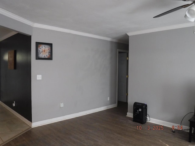 empty room with baseboards, wood finished floors, a ceiling fan, and ornamental molding