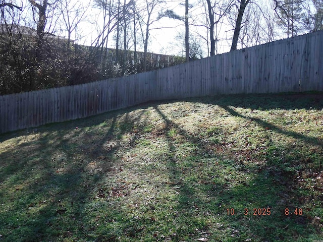 view of yard with a fenced backyard